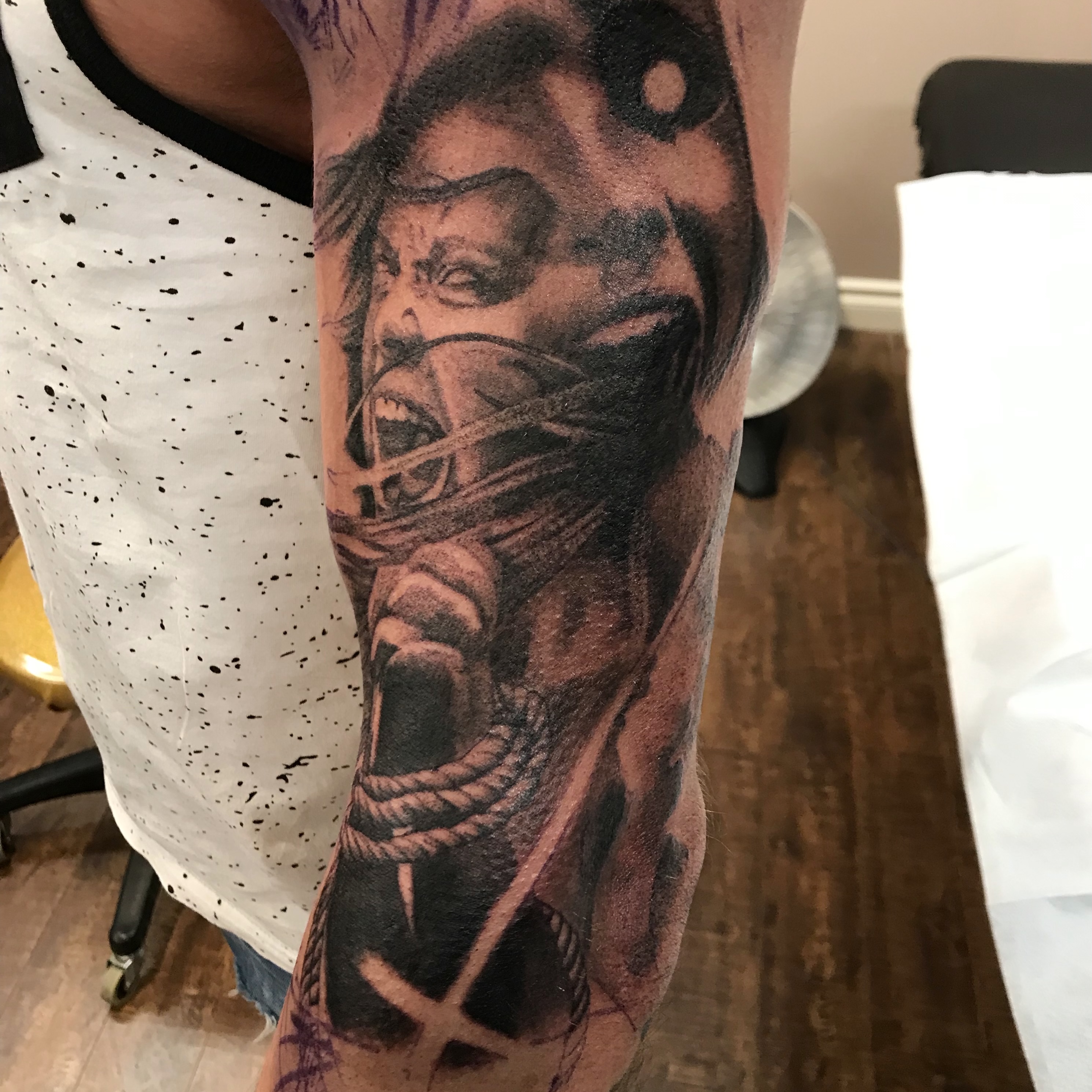Two screaming girls black and grey realism tattoo