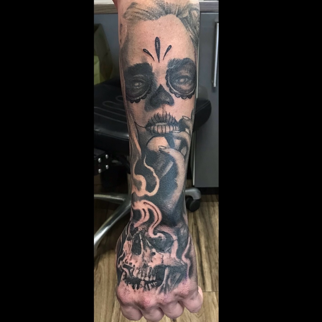 Black and grey girl with skull tattoo