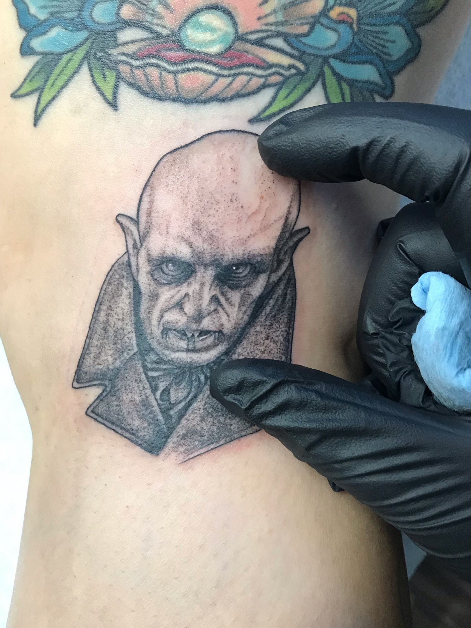 Black and grey portrait tattoo