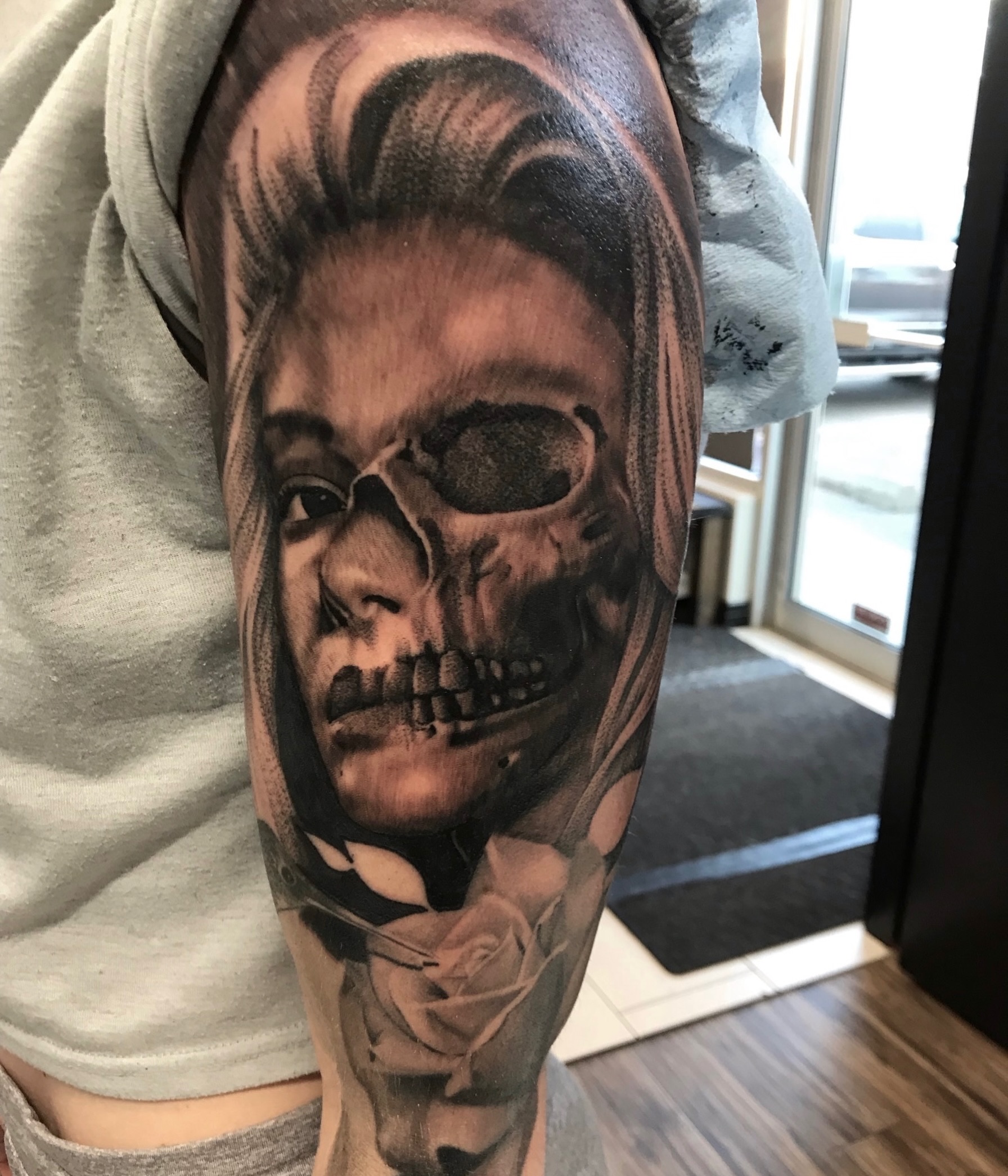Half skull half girl black and grey realism tattoo