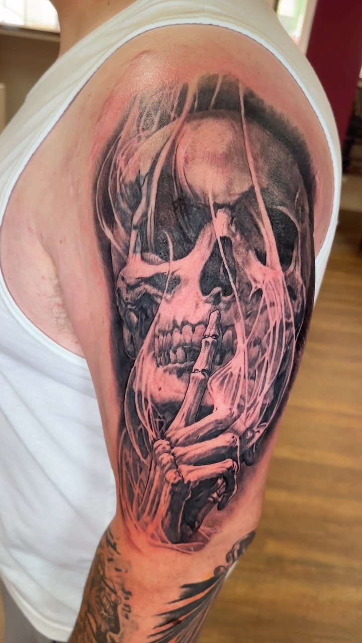 Shhhh skull black and grey realism tattoo