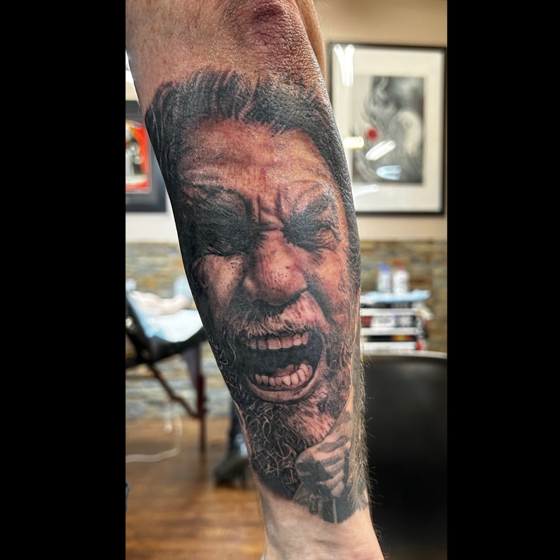 Screaming man portrait sleeve tattoo