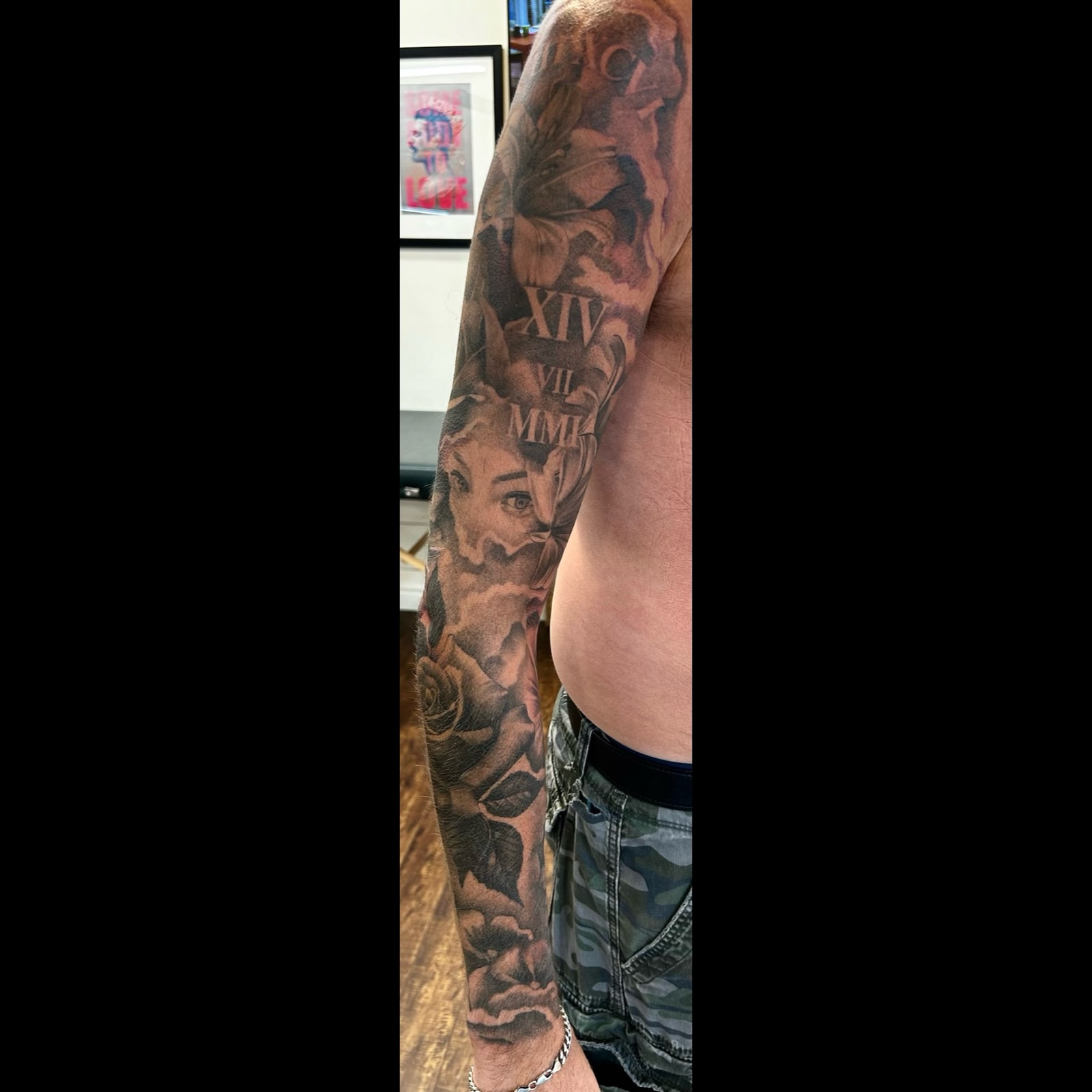 Black and grey realism sleeve tattoo