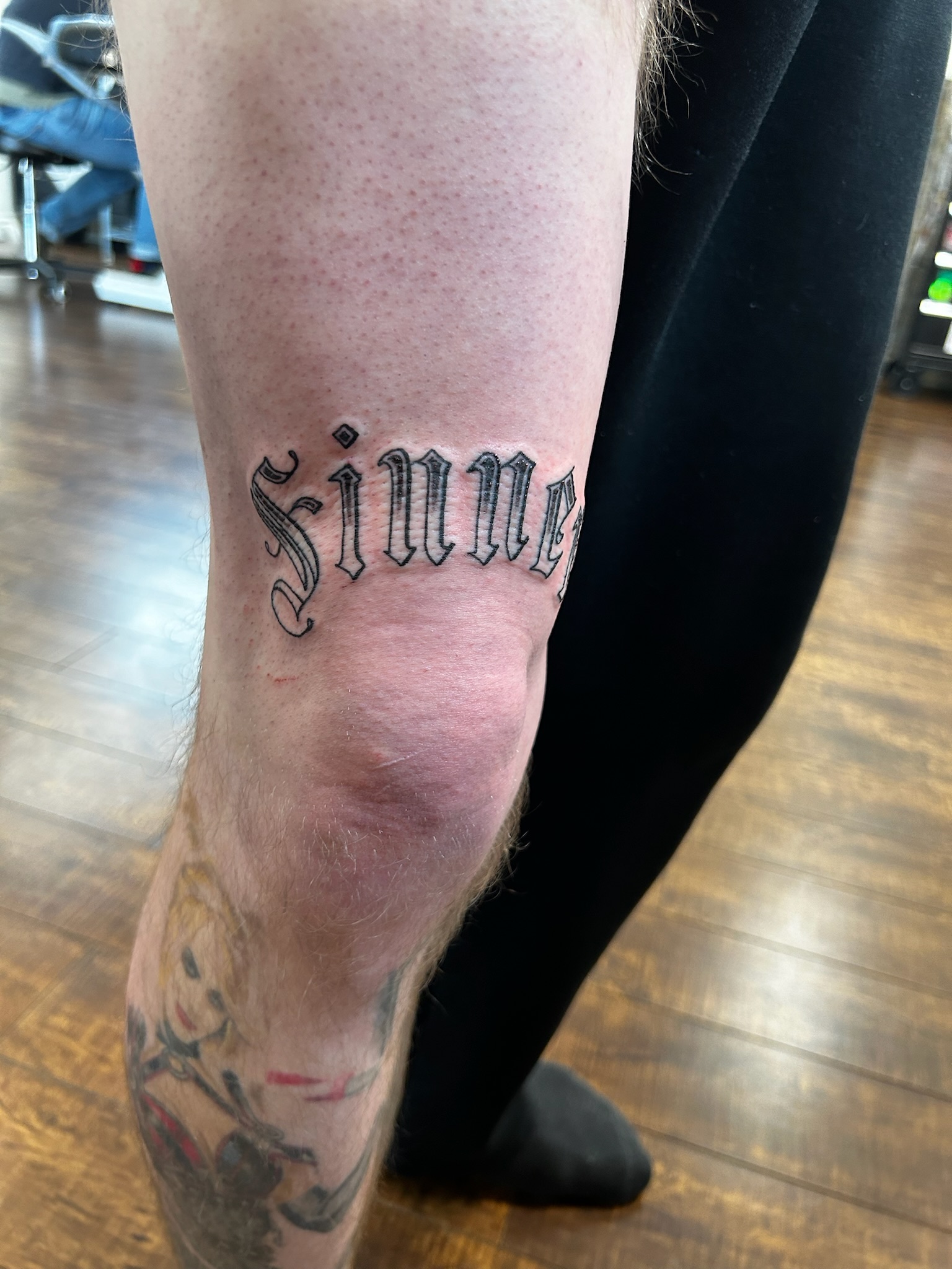 Old English lettering tattoo
