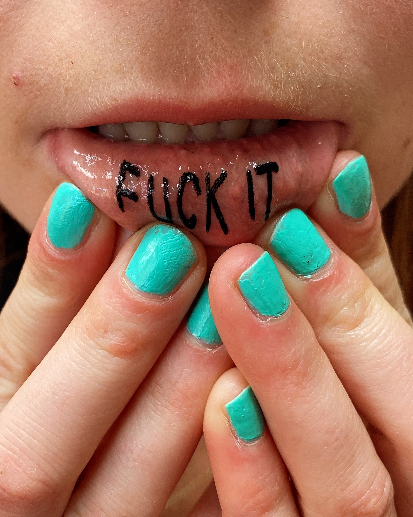 Inner lip lettering tattoo by Marshall
