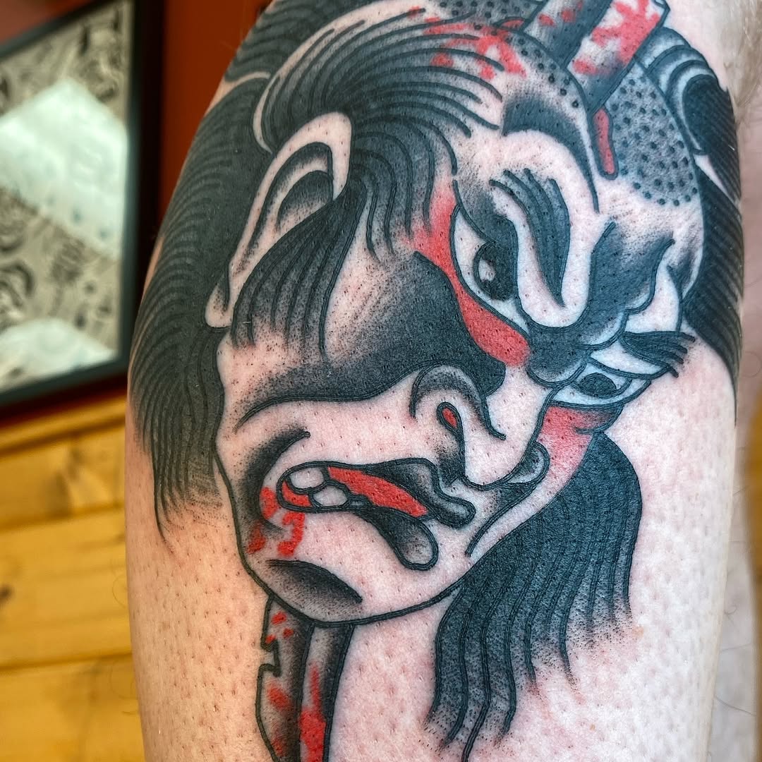 Red, black and grey Japanese mask tattoo by Marshall