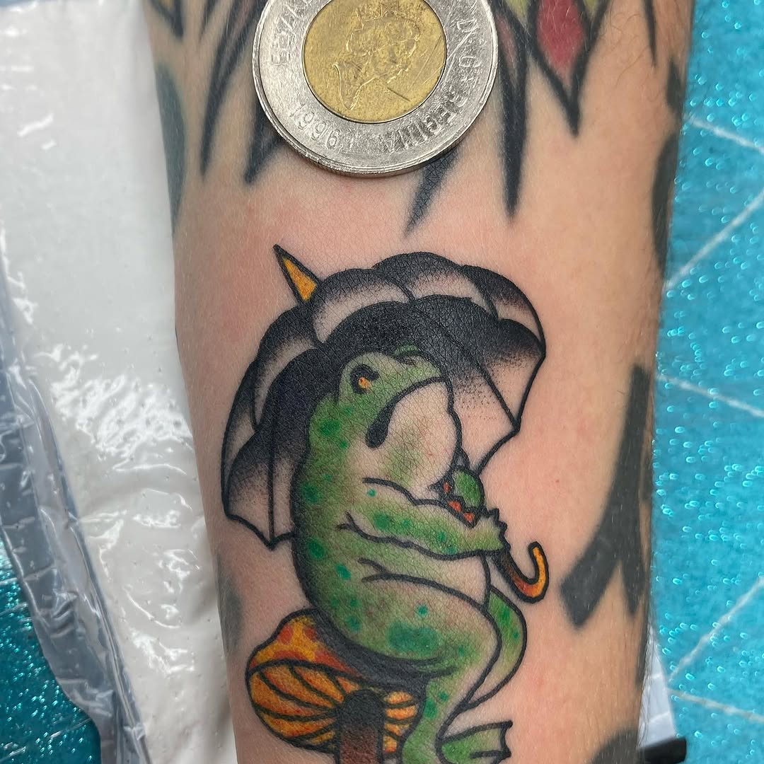 Small green caterpillar holding an umbrella by Marshall