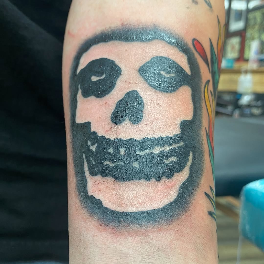 Black skull tattoo by Marshall