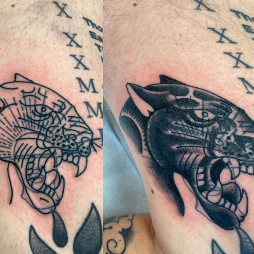Black panther head tattoo by Marshall