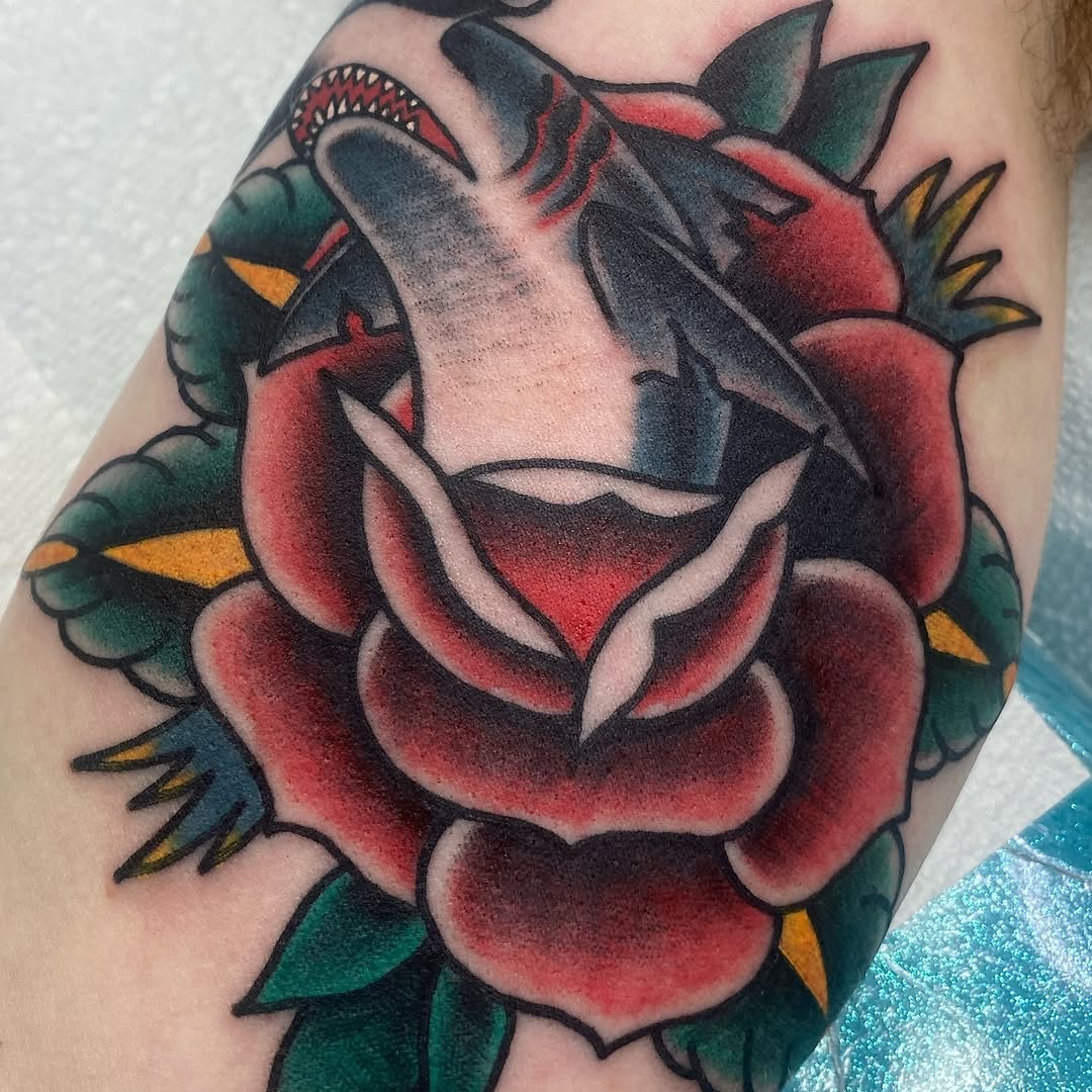 Traditional red rose framing a sailing ship by Marshall