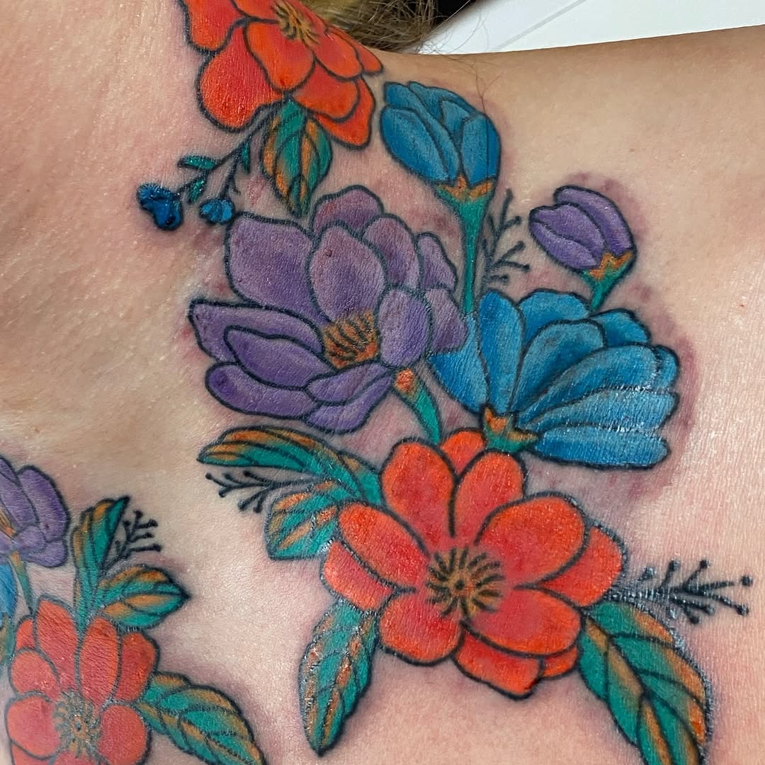 Colour floral tattoos across the neck by Marshall