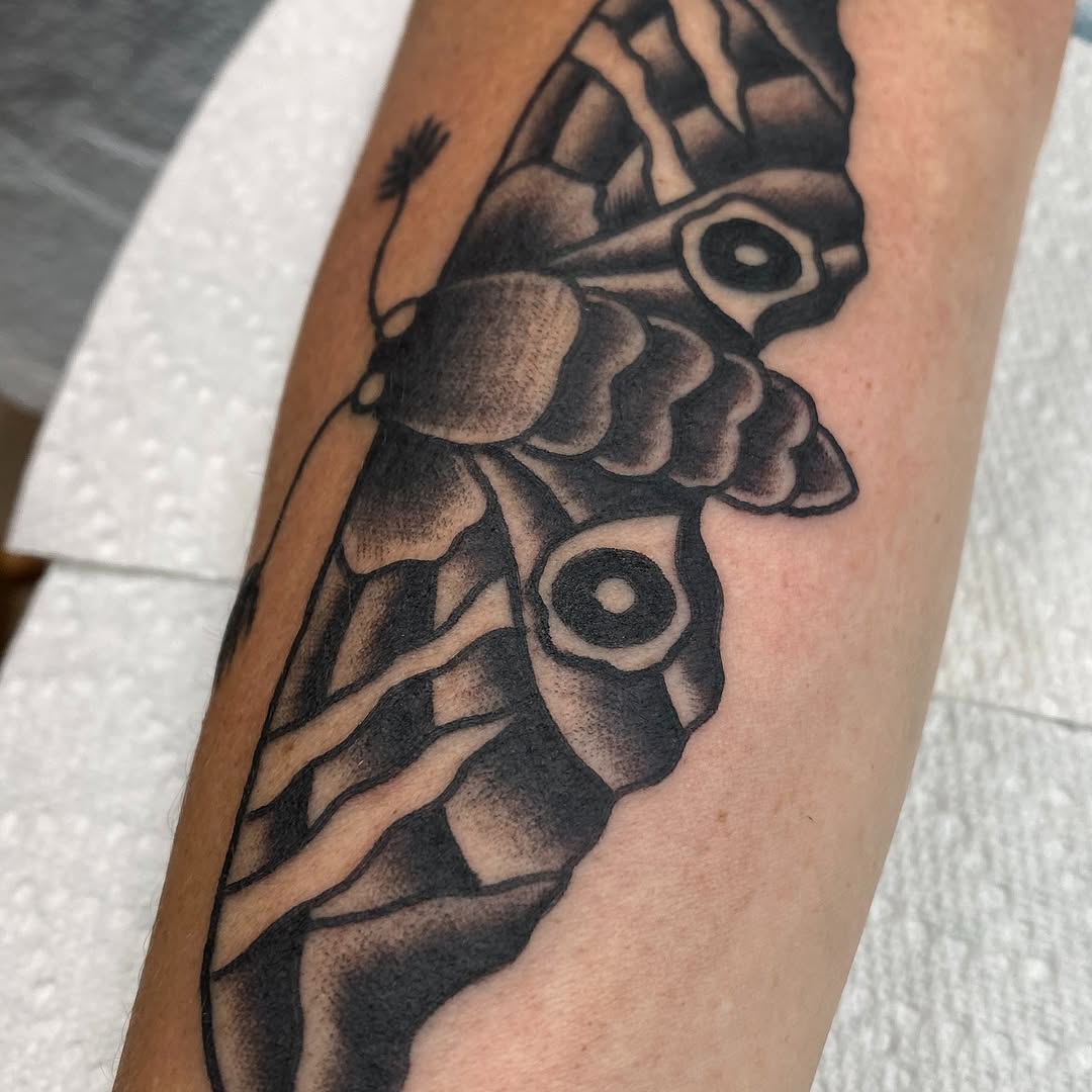Black and grey moth tattoo by Marshall