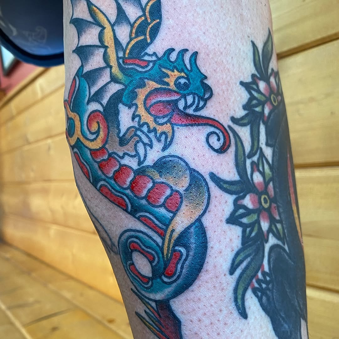 Blue and red dragon head tattoo by Marshall