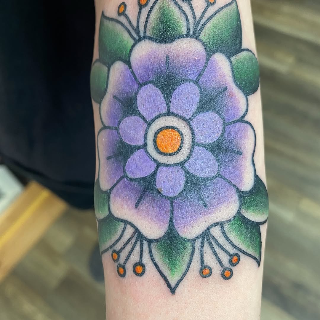 Purple traditional flower tattoo by Marshall