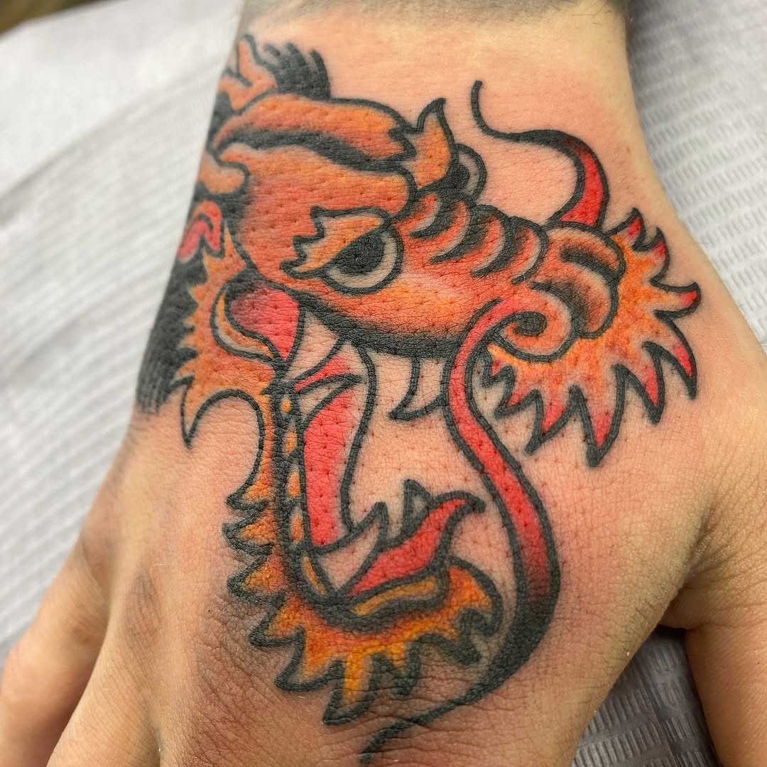 Orange tiger head tattoo by Marshall