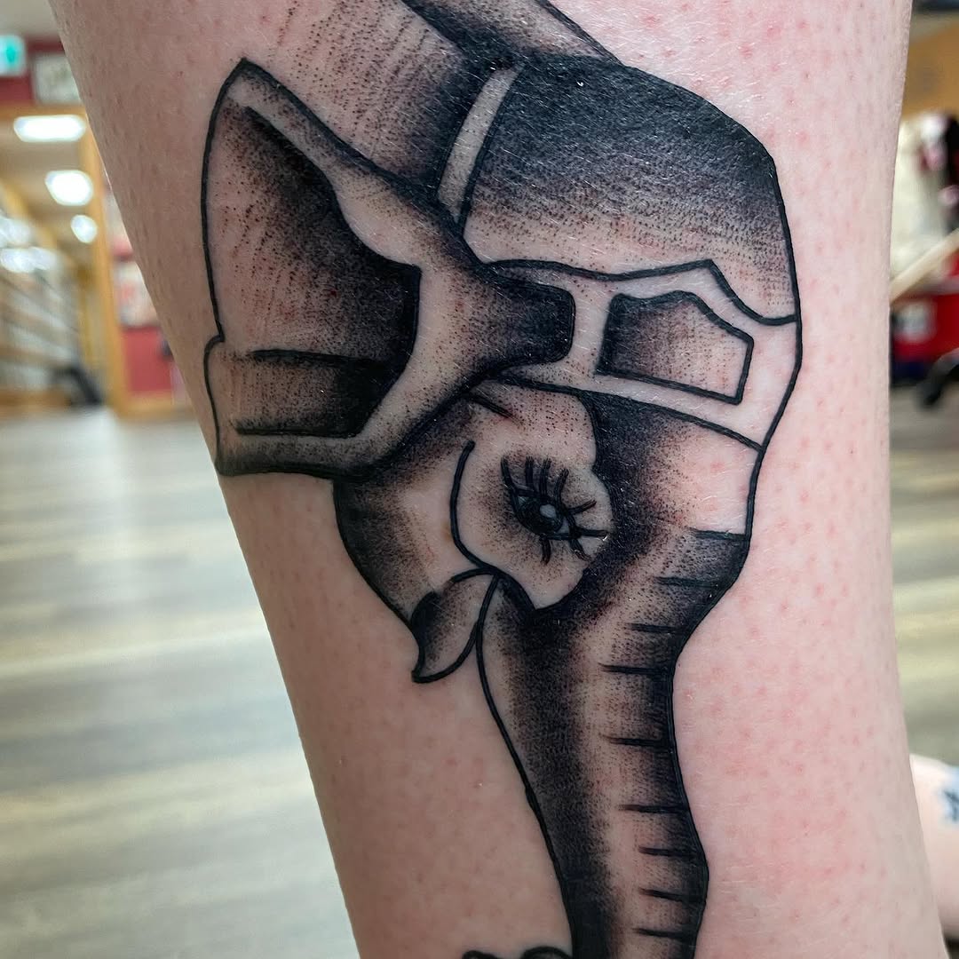 Abstract black and grey skull tattoo by Marshall