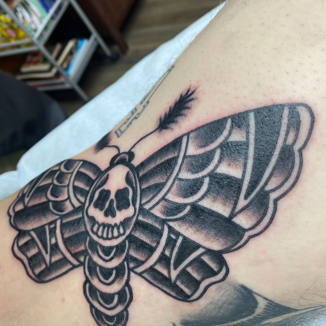Black and grey moth tattoo by Marshall