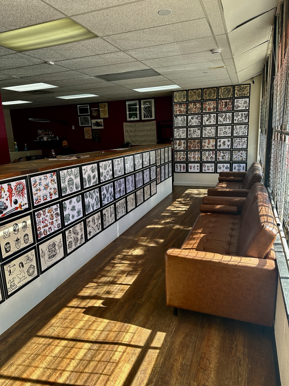 The waiting area and flash walls inside Mythology Tattoo in Edmonton